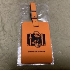 新品、スーツケースとかに目印で付ける物だと思います。