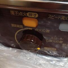 石油ストーブ、ポリタンク、灯油ポンプの画像