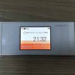 WiMAX ポケットWiFi 端末本体と充電器の画像