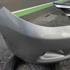日産 ティーダ フロントバンパー シルバー K23の画像