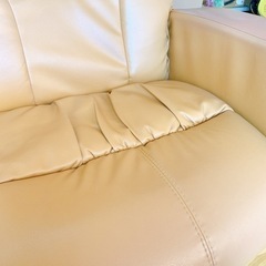 リクライニング　2人掛けソファー　オレンジ・ベージュ色の画像