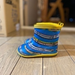 長靴とレインコートの画像