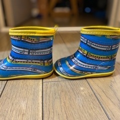 長靴とレインコートの画像