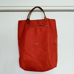 バッグ　縦長　オレンジ　折り畳みの画像