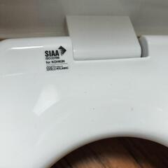 新品トイレ便座と便座カバーのセットの画像