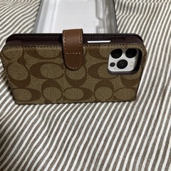 最終値下げ　
若干難あり　COACH iPhone12 12PRO 手帳型　スマホケースの画像
