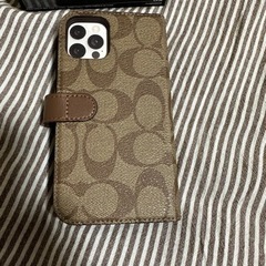 最終値下げ　
若干難あり　COACH iPhone12 12PRO 手帳型　スマホケースの画像