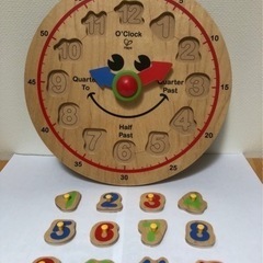 Hape 知育玩具　時計パズルの画像