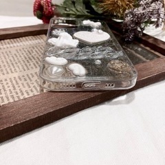 新品未使用　marcydorn エンジェル彫刻モチーフ クリアラメ iPhoneケースの画像