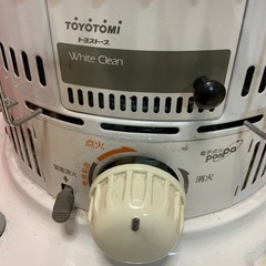 ストーブと灯油缶2個石焼き芋の画像