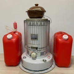 ストーブと灯油缶2個石焼き芋の画像