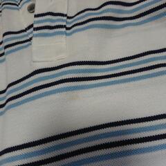 黒と水色のラインのポロシャツ  サイズMの画像