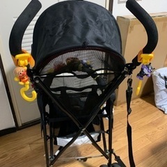 バギータイプベビーカー・おもちゃ、レインカバー付きの画像