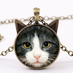 新品・送料無料！猫耳形のかわいいブロンズペンダント・ねこモチーフ...
