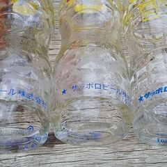 リボンオレンジ空き瓶２５本（うち３本は底割れあり）＋箱の画像