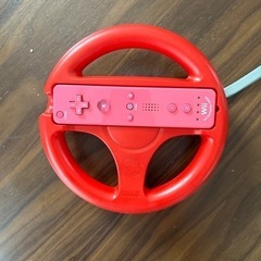 Wiiのコントローラーとマリオハンドルの画像