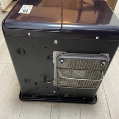 石油ファンヒーター（柵付き）の画像