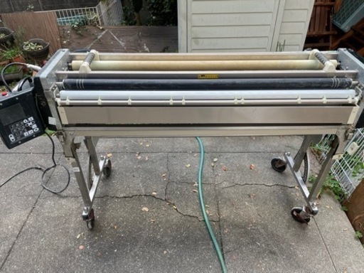 クロス糊付け機