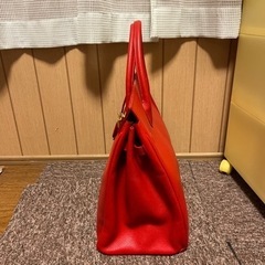 値下げしました‼️皮の赤いバッグ未使用品の画像