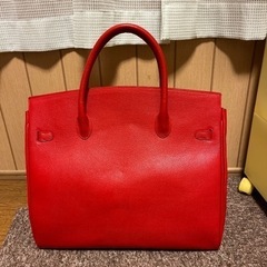 値下げしました‼️皮の赤いバッグ未使用品の画像