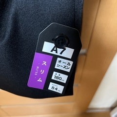 未使用品　ブラックスーツ　A7の画像