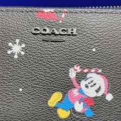 値下げ新品COACHコーチ アコーディオン ホリディ ディズニープリントの画像