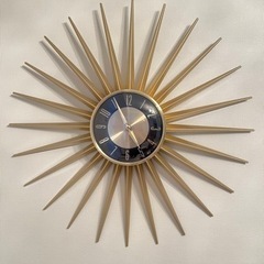 掛け時計　モダン　太陽の画像