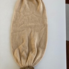 ベージュマフラーの画像
