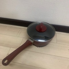 新品未使用中華鍋と中古小鍋の画像