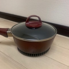 新品未使用中華鍋と中古小鍋の画像