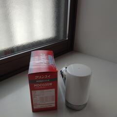 未使用浄水器カートリッジ２個入りと中古浄水器の画像