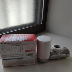 未使用浄水器カートリッジ２個入りと中古浄水器の画像