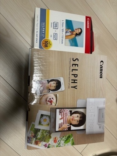 家庭用写真プリンター、交換用インクと台紙100枚程度