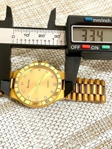 [希少:ヴィンテージ/稼働]BULOVA ブローバ 12Pダイヤ/ローマベゼル/ゴールド/薄型/バタフライバックル/腕時計