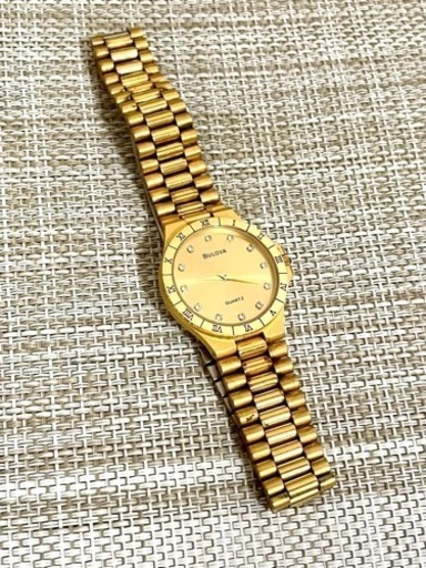 [希少:ヴィンテージ/稼働]BULOVA ブローバ 12Pダイヤ/ローマベゼル/ゴールド/薄型/バタフライバックル/腕時計