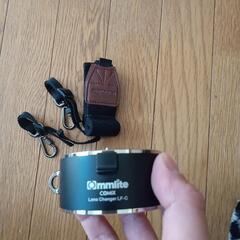 カメラレンズ持ち運び首掛け道具。新品の画像