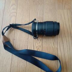 カメラレンズ持ち運び首掛け道具。新品の画像