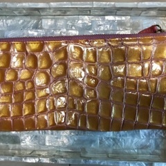 オレンジ色の財布(カードケース)の画像