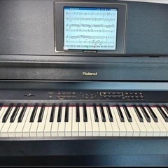 ローランドRolandの電子ピアノ、椅子付きの画像