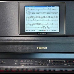 ローランドRolandの電子ピアノ、椅子付きの画像