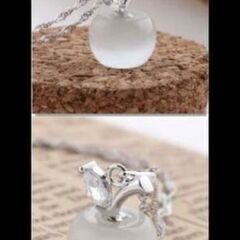 ≒j→→→m31-4番 ムーンストーン調アップルペンダントホワイトの画像