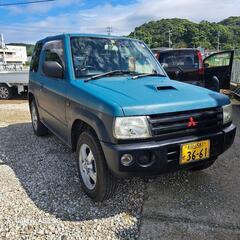 平成20年パジェロミニてす。ターボ車、少し左側が凹凸があります。令和7年3月まで、車検がございます。今も調子がよく走っています。あくまでも中古車なのでノークレムノーリターンでお願いします。名義変更までの預り金三万円を預からせて頂きます。名義変更完了後速やかに返金いたします。の画像