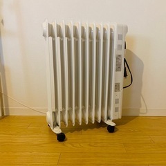 机、ソファー、植木鉢、ヒーターの画像