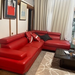 A modern and stylish large sofa of almost a new type.