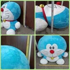 ★［F1784］〈中古品〉ドラえもん　ぬいぐるみ　寸法　幅(手の部分)約75㎝  高さ約70㎝  厚み約40㎝の画像
