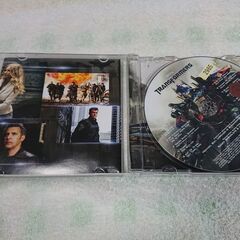 ♠　Transformers: Dark Of The Moon - The Album　映画『トランスフォーマー: ダーク オブ ザ ムーン』のさまざまなアーティストの音楽を集めたコンピレーション アルバムです。の画像