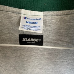 XLARGE × Champion 緑色 ジャケット Mサイズの画像