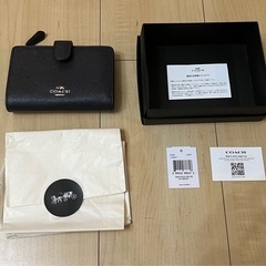 二つ折り財布　coachの画像