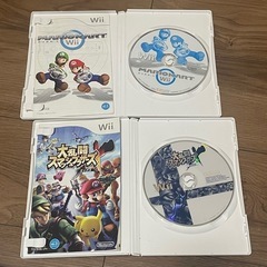 Wii本体+ハンドル+4、コントローラ+2、ソフト×2の画像