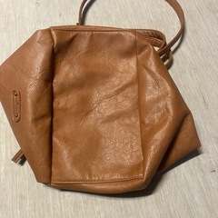 契約中　か　茶色バックの画像